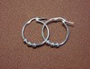  Silver hoop and ball earrings  
